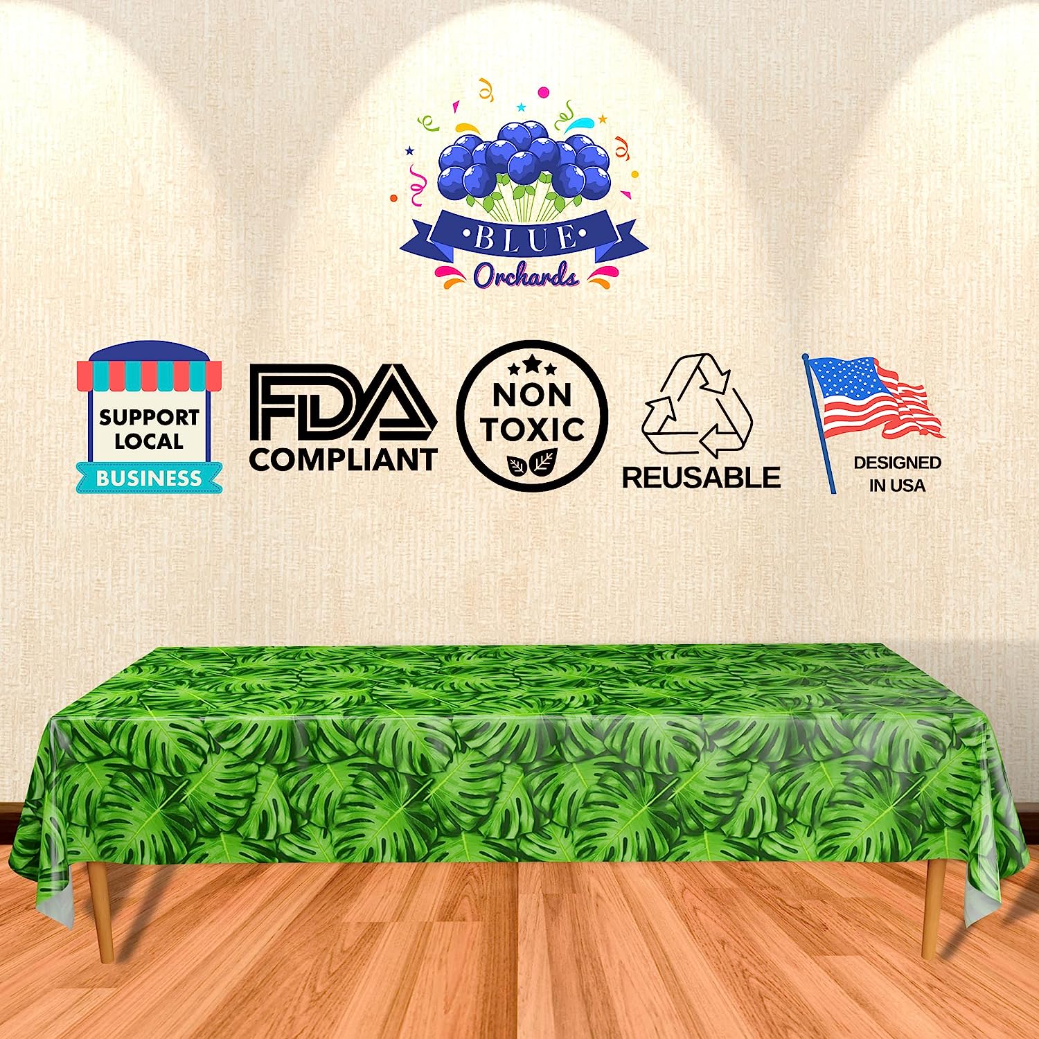 Two FDA Compliant, non toxic, reusable, and designed in USA palm leaf patterned table covers, each measuring approximately 108 inches by 54 inches, displayed on a wooden table with a white background.