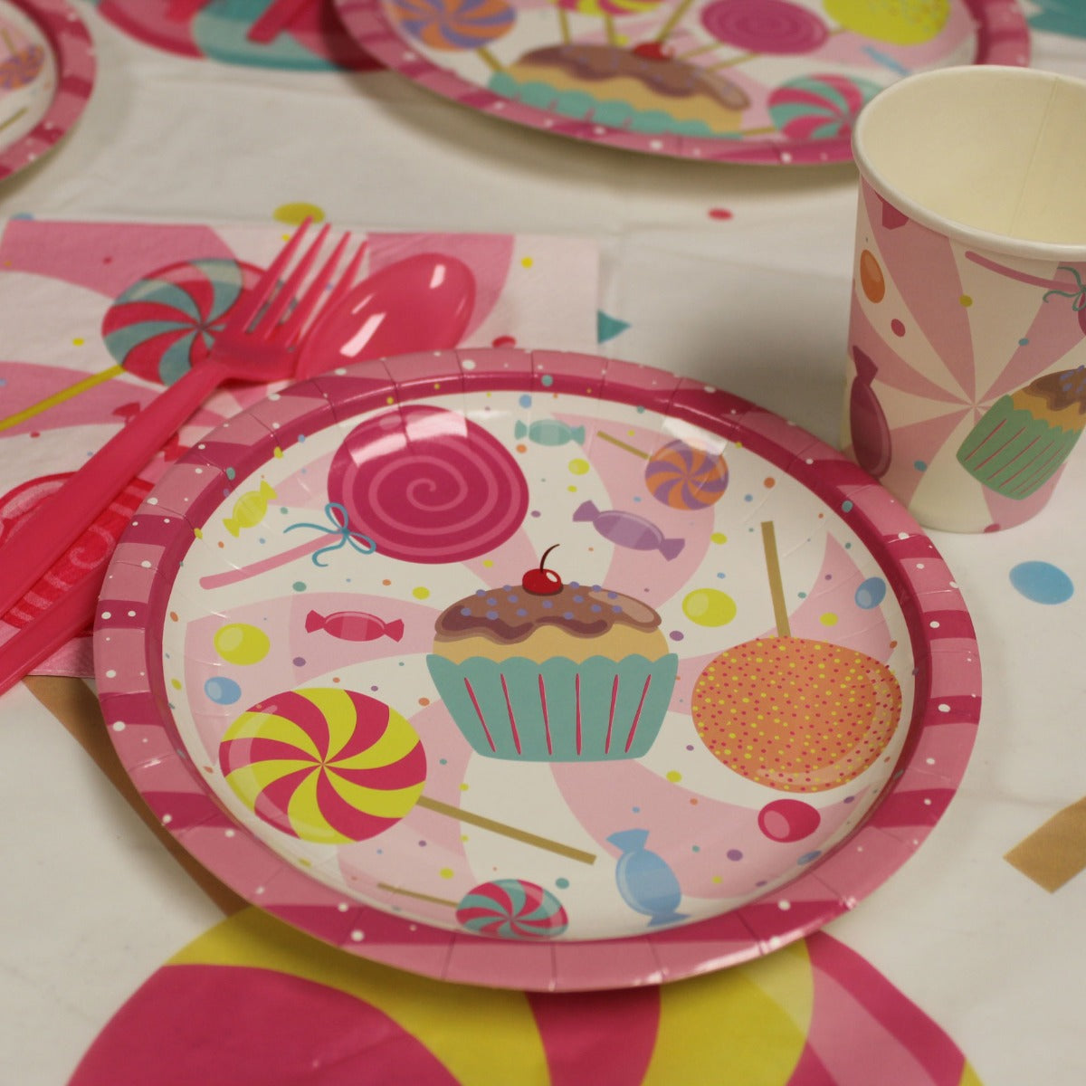 Candy Party Table Covers on the table with Candyland Plate and Candy Cups on top